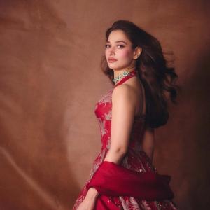 Tamannaah Bhatia Stunning in Red Dress with Exquisite Emerald Jewelry