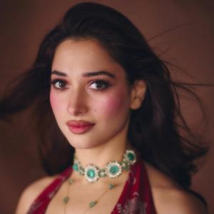 Tamannaah Bhatia Stunning in Red Dress with Exquisite Emerald Jewelry