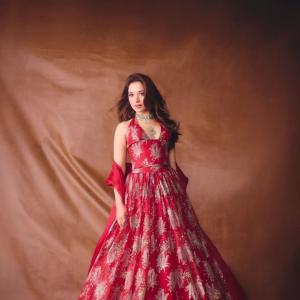 Tamannaah Bhatia Stunning in Red Dress with Exquisite Emerald Jewelry
