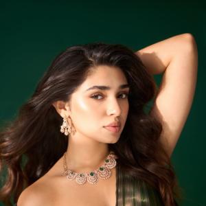 Kriti Shetty Shines in Green Gown with Elegant Emerald Jewelry