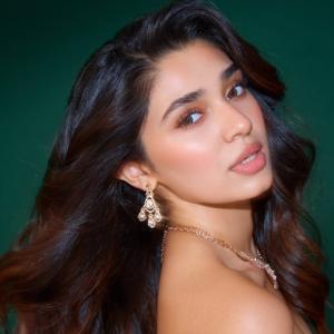 Kriti Shetty Shines in Green Gown with Elegant Emerald Jewelry