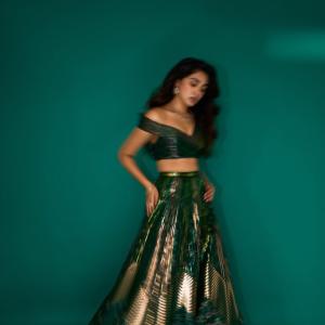 Kriti Shetty Shines in Green Gown with Elegant Emerald Jewelry