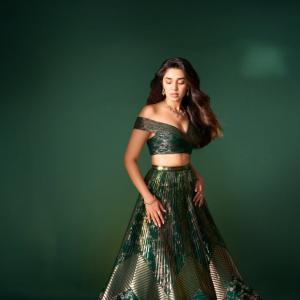 Kriti Shetty Shines in Green Gown with Elegant Emerald Jewelry