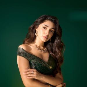 Kriti Shetty Shines in Green Gown with Elegant Emerald Jewelry