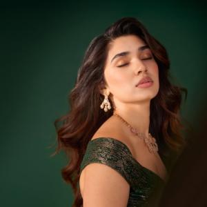 Kriti Shetty Shines in Green Gown with Elegant Emerald Jewelry