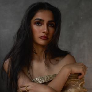 Actress Rukmini Vasanth Stuns In Golden Saree