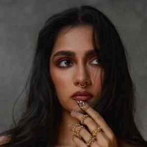 Actress Rukmini Vasanth Stuns In Golden Saree