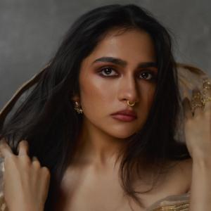 Actress Rukmini Vasanth Stuns In Golden Saree