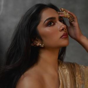 Actress Rukmini Vasanth Stuns In Golden Saree