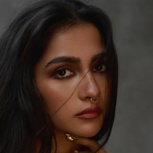 Actress Rukmini Vasanth Stuns In Golden Saree