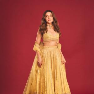 Neha Shetty Stuns in Golden Embroidered Outfit with Elegant Choker Look