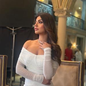 Actress Akanksha Puri in Elegant Off-Shoulder White Dress