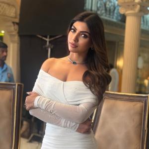 Actress Akanksha Puri in Elegant Off-Shoulder White Dress