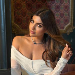 Actress Akanksha Puri in Elegant Off-Shoulder White Dress