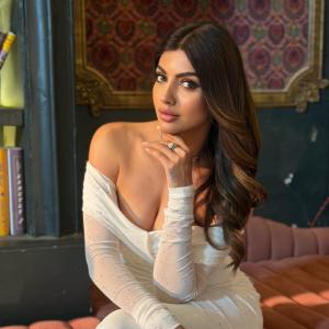 Actress Akanksha Puri in Elegant Off-Shoulder White Dress