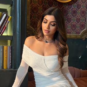 Actress Akanksha Puri in Elegant Off-Shoulder White Dress