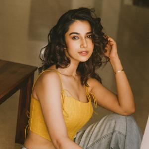 Actress Meenakshi Chaudhary in Yellow Sleeveless Top