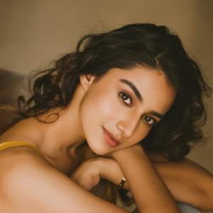 Actress Meenakshi Chaudhary in Yellow Sleeveless Top