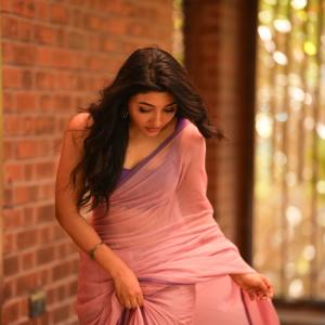 Mirnaa Looks Graceful in Pink Saree Photoshoot