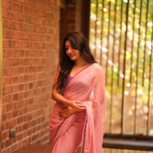Mirnaa Looks Graceful in Pink Saree Photoshoot