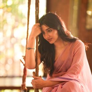 Mirnaa Looks Graceful in Pink Saree Photoshoot