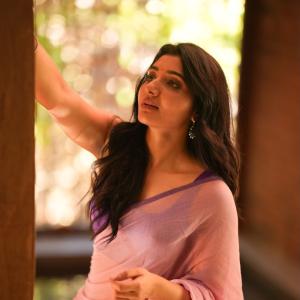 Mirnaa Looks Graceful in Pink Saree Photoshoot