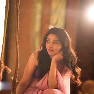 Mirnaa Looks Graceful in Pink Saree Photoshoot