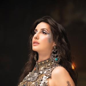 Nora Fatehi Stunning Dance Pose in Silver Mirror-Coin Costume