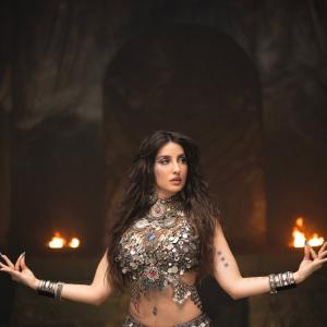 Nora Fatehi Stunning Dance Pose in Silver Mirror-Coin Costume