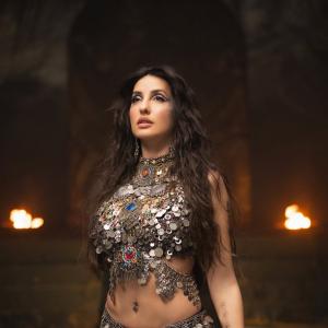 Nora Fatehi Stunning Dance Pose in Silver Mirror-Coin Costume
