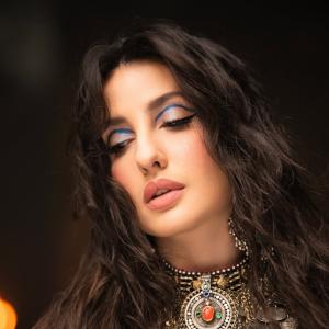 Nora Fatehi Stunning Dance Pose in Silver Mirror-Coin Costume