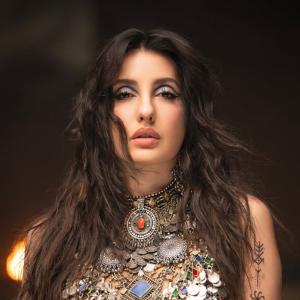 Nora Fatehi Stunning Dance Pose in Silver Mirror-Coin Costume