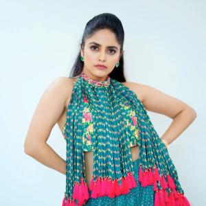 Pragya Nayan in Vibrant Teal Floral Dress with Pink Tassels