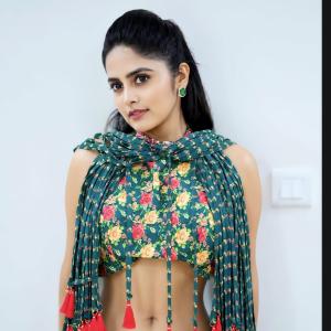 Pragya Nayan in Vibrant Teal Floral Dress with Pink Tassels