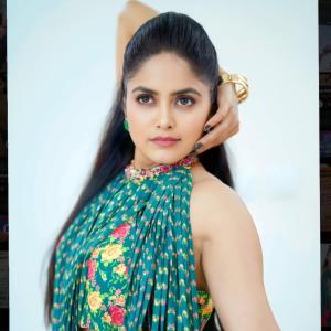 Pragya Nayan in Vibrant Teal Floral Dress with Pink Tassels