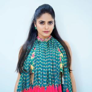 Pragya Nayan in Vibrant Teal Floral Dress with Pink Tassels