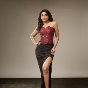 Actress Mirnaa stuns in maroon corset look in fashion photoshoot