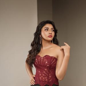 Actress Mirnaa stuns in maroon corset look in fashion photoshoot