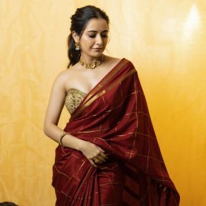 Ashika Rangnath graceful ethnic look in golden light