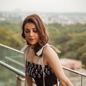 Actress Kajal Aggarwal Looks Elegant In Black Outfit With City Backdrop