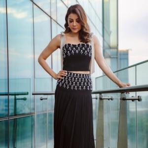 Actress Kajal Aggarwal Looks Elegant In Black Outfit With City Backdrop