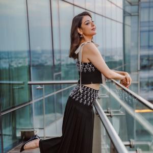 Actress Kajal Aggarwal Looks Elegant In Black Outfit With City Backdrop