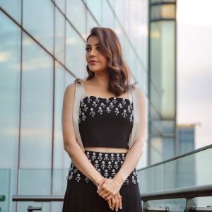 Actress Kajal Aggarwal Looks Elegant In Black Outfit With City Backdrop