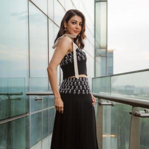 Actress Kajal Aggarwal Looks Elegant In Black Outfit With City Backdrop