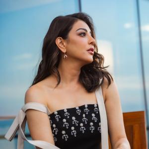 Actress Kajal Aggarwal Looks Elegant In Black Outfit With City Backdrop