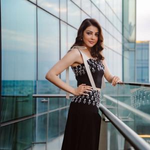Actress Kajal Aggarwal Looks Elegant In Black Outfit With City Backdrop