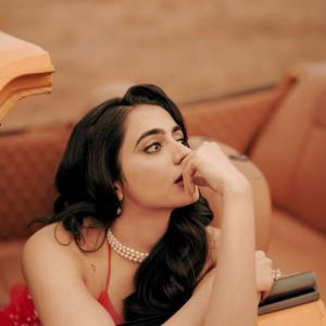 Manasa Choudhary Stuns in a Red Gown With a Retro Car