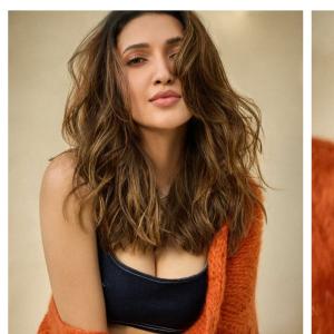 Neha Shetty Stuns in Denim Crop Top and Orange Cardigan