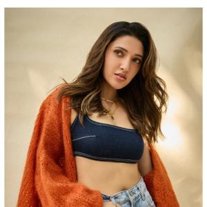 Neha Shetty Stuns in Denim Crop Top and Orange Cardigan