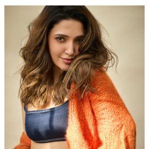 Neha Shetty Stuns in Denim Crop Top and Orange Cardigan